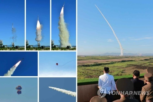 North Korea test-fires a new type of anti-aircraft guided weapon system, with its leader Kim Jong-un watching at an observation post in this compilation photo released by Pyongyang's state media on May 28, 2017. (For Use Only in the Republic of Korea. No Redistribution) (KCNA-Yonhap)
