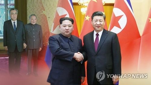 This image, provided by Yonhap News TV, shows North Korean leader Kim Jong-un (L) and Chinese leader Xi Jinping. (Yonhap)
