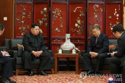 This photo, carried by North Korea's state-run news agency, on April 24, 2018, shows North Korean leader Kim Jong-un (L) visiting China's Embassy in Pyongyang to mourn Chinese tourists killed in bus accident that occurred in the North days earlier. (For Use Only in the Republic of Korea. No Redistribution) (Yonhap)