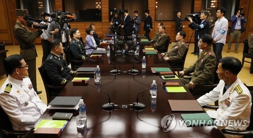 Military officials from the two Koreas hold rare talks at the inter-Korean truce village of Panmunjom on June 14, 2018, in this photo released by the joint press corps. (Yonhap)
