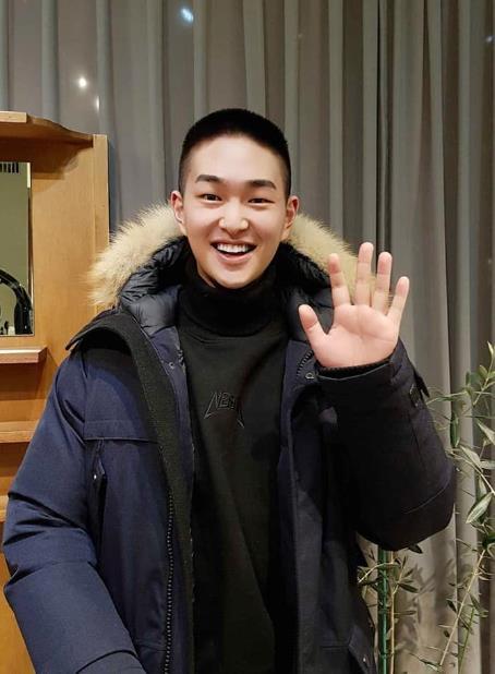 This image of Onew, boy band SHINee's member, with a short, military-style haircut, is captured from a SHINee social media account. (Yonhap) 