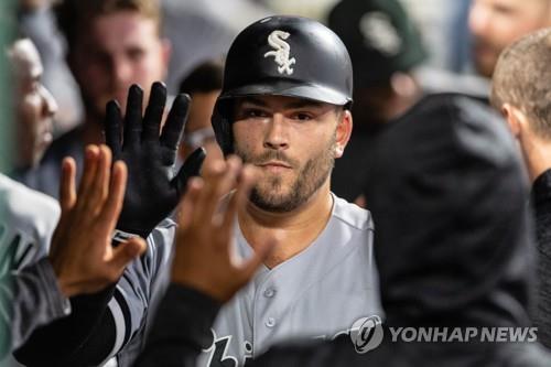 In this Getty Images file photo from Sept. 18, 2018, Daniel Palka of the Chicago White Sox is greeted by his teammates after hitting a solo home run against the Cleveland Indians in the top of the sixth inning of a Major League Baseball regular season game at Progressive Field in Cleveland. (Yonhap)