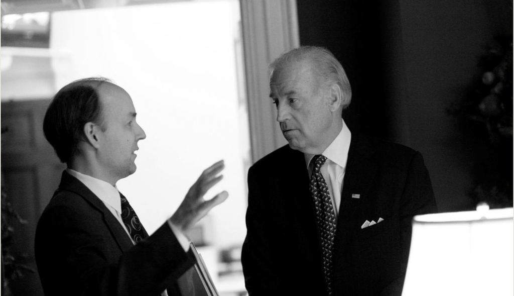 Joe Biden (R), the U.S. Democratic presidential nominee, and his long-time foreign policy adviser Brian McKeon are seen talking with each other in this undated photo provided by Biden's election campaign. (Yonhap)