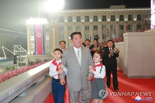 North Korean leader Kim Jong-un (C), accompanied by children, takes part in a military parade at Kim Il-sung Square in Pyongyang on Sept. 9, 2021, to celebrate the 73rd anniversary of the country's founding, in this photo released by the North's official Korean Central News Agency. (For Use Only in the Republic of Korea. No Redistribution) (Yonhap)