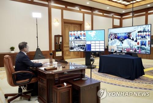 This file photo shows South Korean President Moon Jae-in holding a teleconference with leaders of the 10-member Association of Southeast Asian Nations, China and Japan at the presidential office Cheong Wa Dae in Seoul on April 14, 2020, to discuss ways to tackle the new coronavirus pandemic, in this photo released by the presidential office. (PHOTO NOT FOR SALE) (Yonhap)