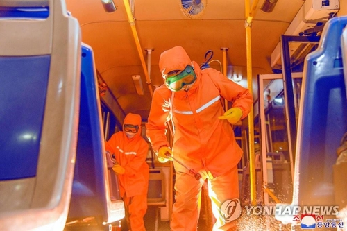 This file photo, released by North Korea's official Korean Central News Agency on June 4, 2022, shows workers sterilizing the inside of a train in Pyongyang. North Korea reported about 79,100 new suspected COVID-19 cases on the day. (For Use Only in the Republic of Korea. No Redistribution) (Yonhap)