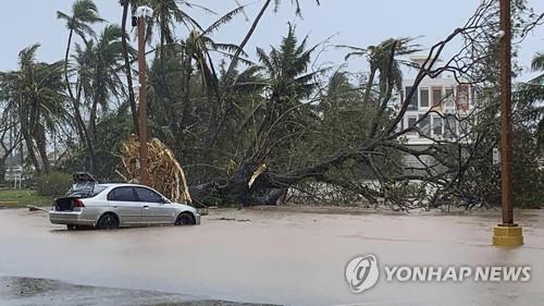 This AP photo shows the overflowing Hagatna River in Hagatna, Guam, on May 25, 2023, in the aftermath of Typhoon Mawar. (Yonhap)