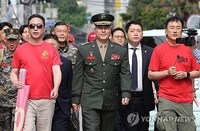 (LEAD) Former defense chief named as witness for influence-peddling case over Marine's death
