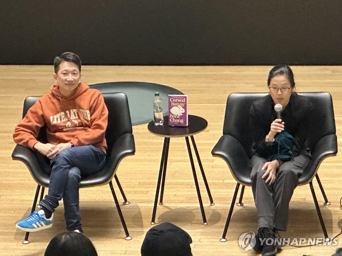 Anton Hur (L) and Jung Bo-ra, the author of "Cursed Bunnies," attend a press event to meet with readers in New York on Nov. 3, 2023. (Yonhap)
