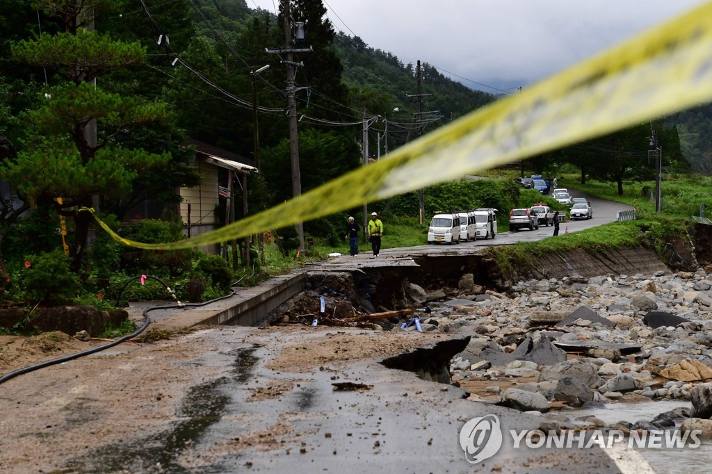 TOPSHOT-CORRECTION-JAPAN-WEATHER-RAIN-FLOOD