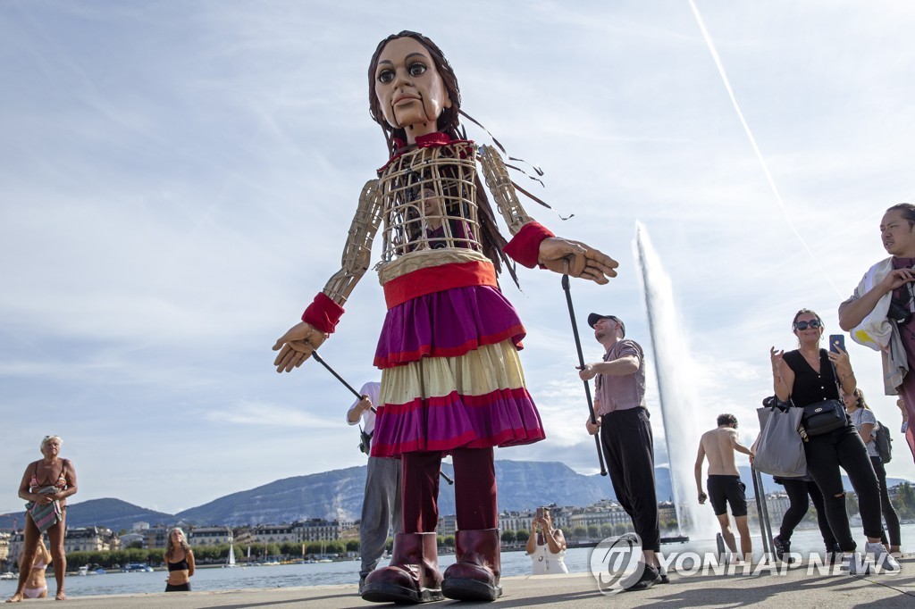 SWITZERLAND GIANT PUPPET AMAL REFUGEE