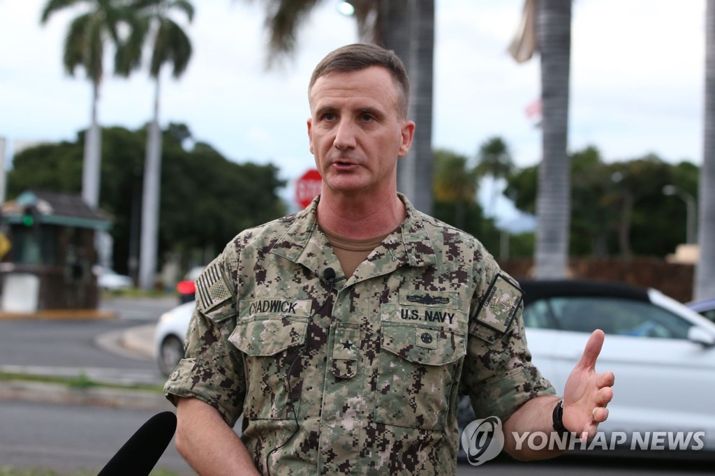 US-THREE-PEOPLE-SHOT-AT-PEARL-HARBOR-NAVAL-SHIPYARD-LEAVES-IN-HA