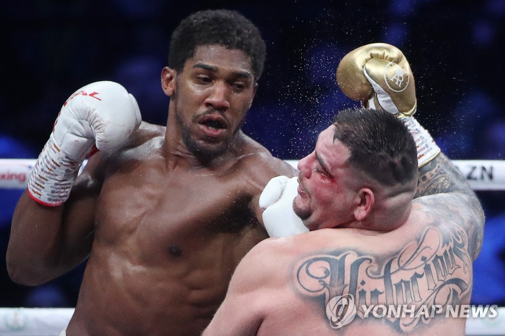 British boxer Anthony Joshua wins back his world heavyweight titles in Saudi Arabia
