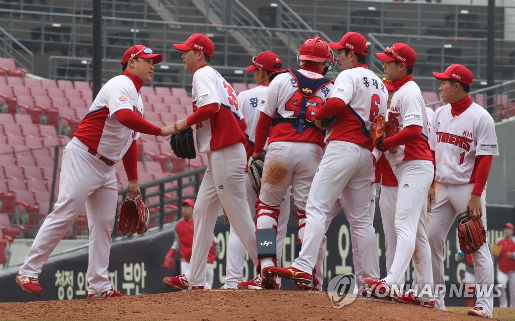 In this file photo from March 12, 2019, players of the Kia Tigers celebrate their 4-1 victory over the SK Wyverns in the Korea Baseball Organization preseason action at Gwangju-Kia Champions Field in Gwangju, 330 kilometers south of Seoul. (Yonhap)