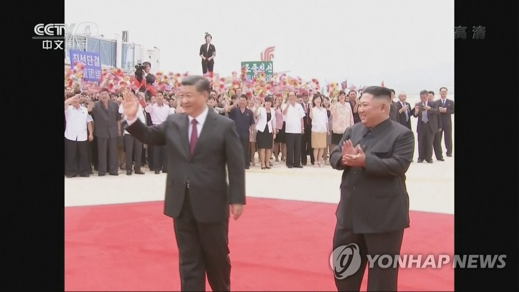 Chinese President Xi waving in Pyongyang Chinese President Xi waving in Pyongyang