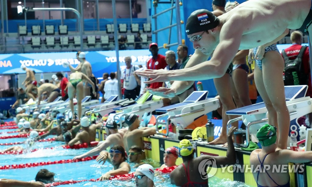 Swimmers practice for World Championships competition Swimmers practice for World Championships competition