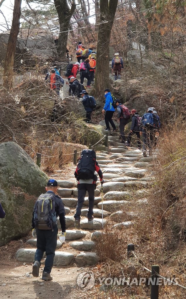 People climb up Mountain Bukhan People climb up Mountain Bukhan