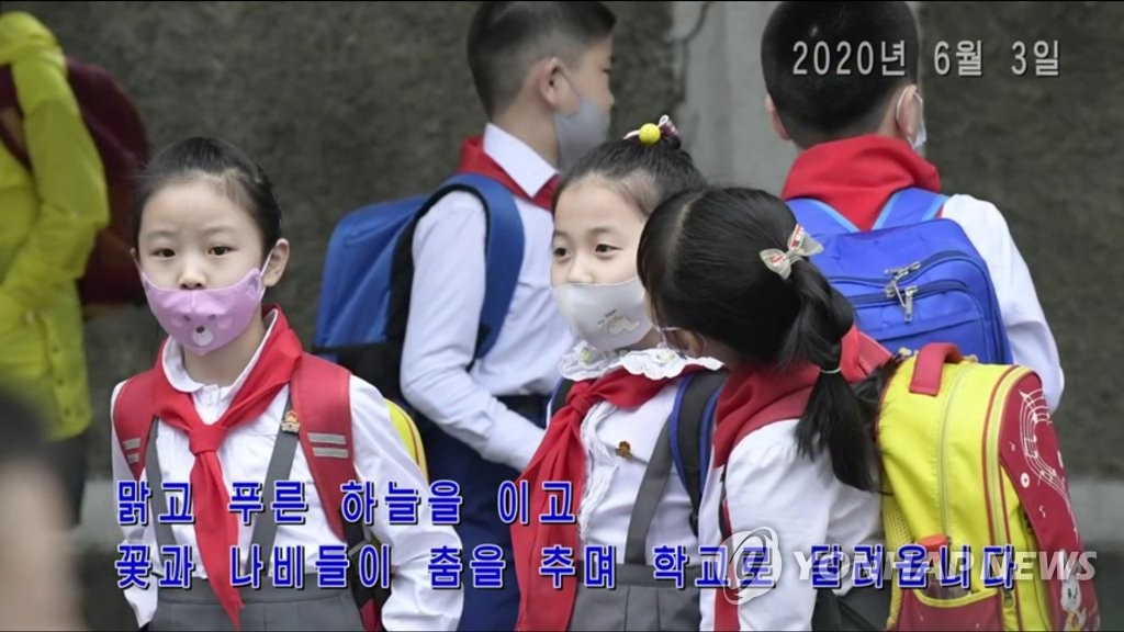 This footage, captured from Uriminzokkri Television aired in North Korea, shows North Korean students at an elementary school in Pyongyang returning to their classrooms during the coronavirus pandemic. (PHOTO NOT FOR SALE) (Yonhap)