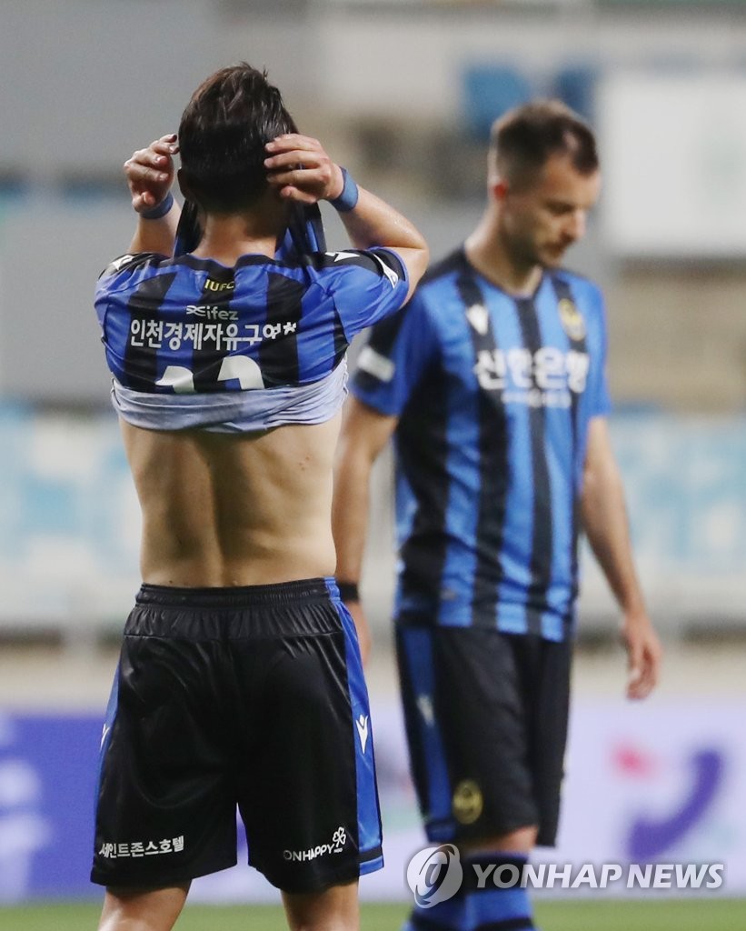 In this file photo from June 5, 2020, members of Incheon United react to their 2-1 loss to Gangwon FC in their K League 1 match at Incheon Football Stadium in Incheon, 40 kilometers west of Seoul. (Yonhap)