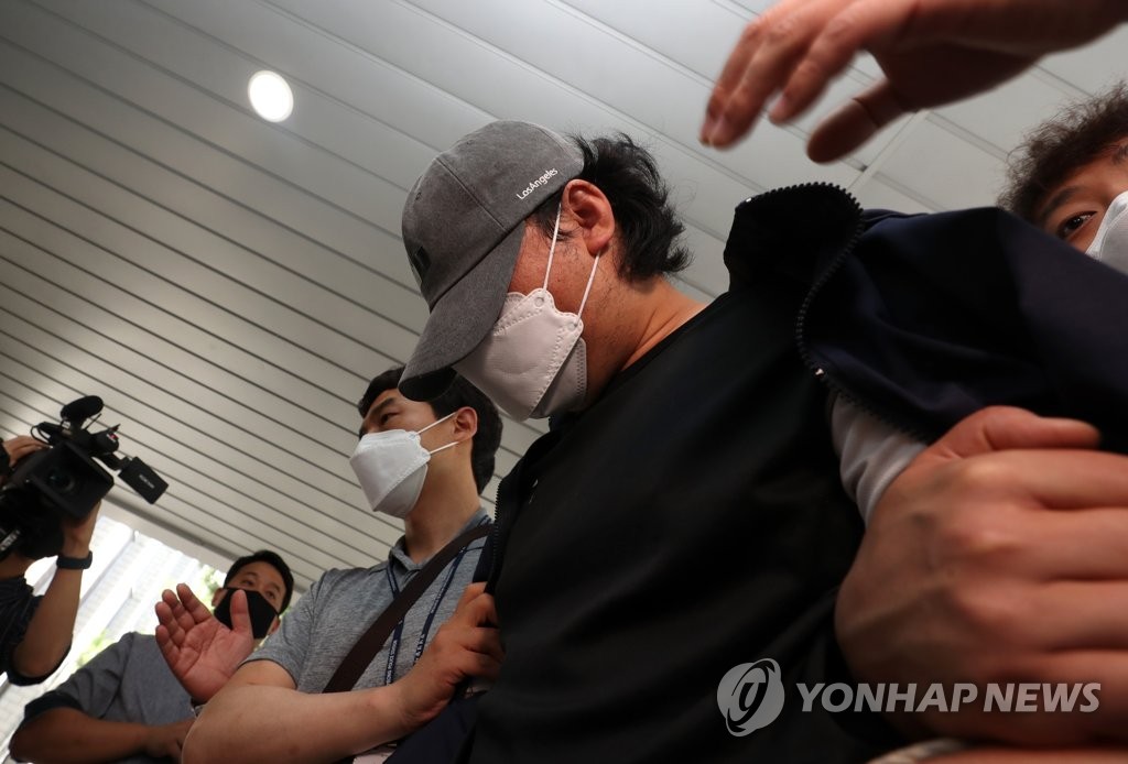 A man attends a hearing at the Miryang branch of the Changwon District Court in Miryang, 386 kilometers south of Seoul, on June 15, 2020, on allegations of abusing his step daughter. (Yonhap)