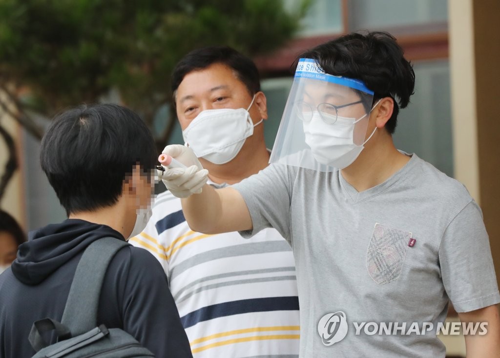 Applicants take public servant test amid coronavirus pandemic Applicants take public servant test amid coronavirus pandemic