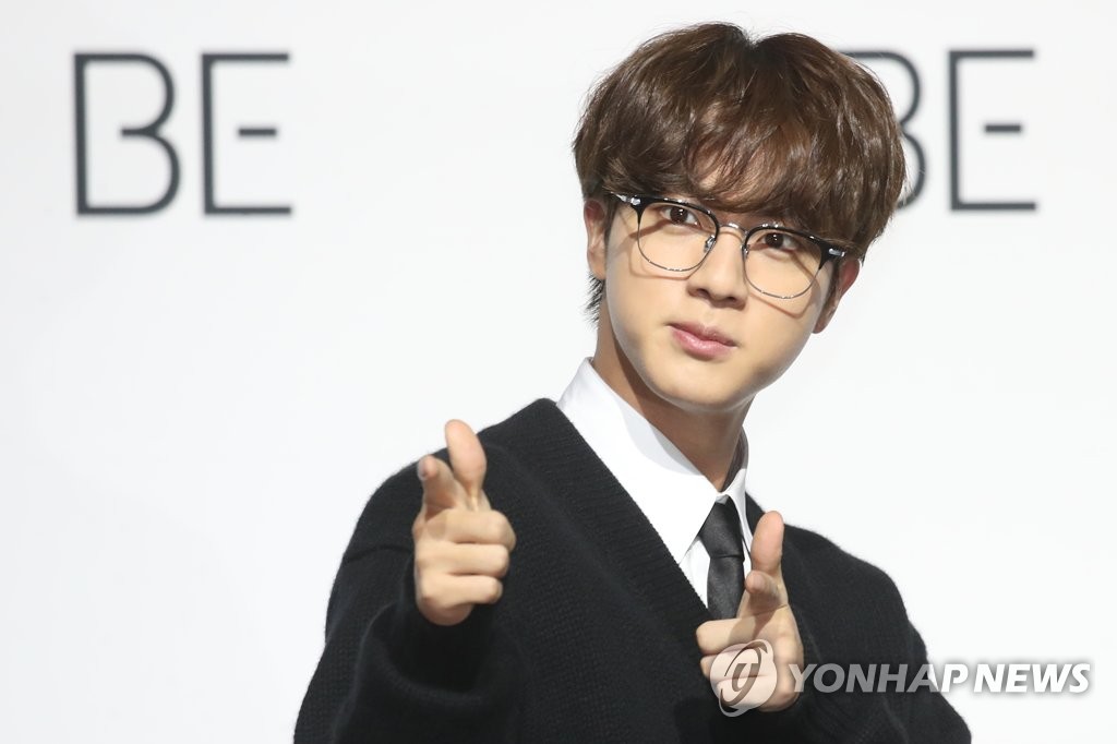 Jin of BTS poses for the camera during a press conference held at the Dongdaemun Design Plaza in central Seoul on Nov. 20, 2020. (Yonhap)