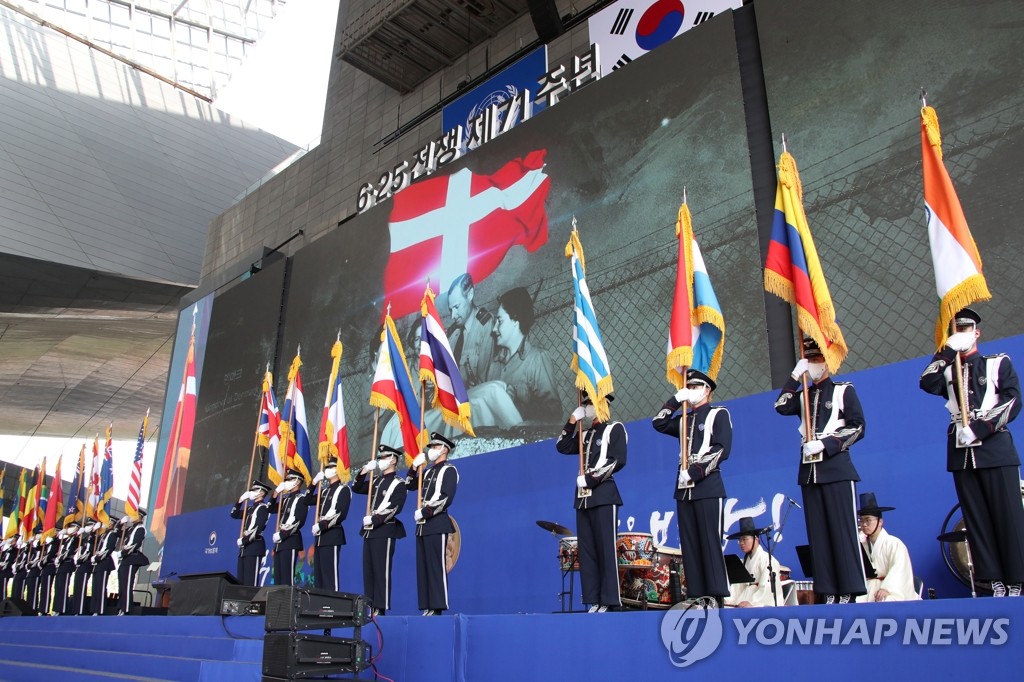 The national flags of countries that participated in the 1950-53 Korean War are presented at an event marking the 71st anniversary of the outbreak of the inter-Korean conflict held at the Busan Cinema Center in Busan, 450 kilometers southeast of Seoul, on June 25, 2021. (Yonhap) 