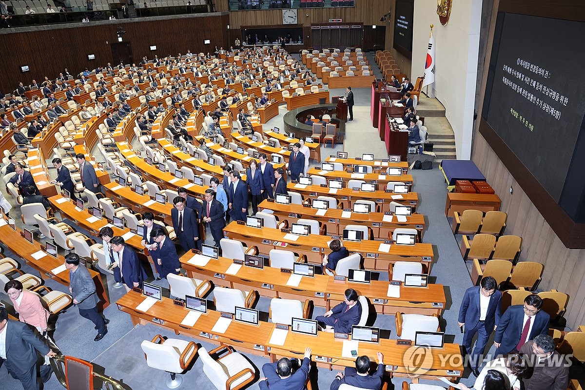 Lawmakers of the ruling People Power Party leave a plenary parliamentary session in protest, after a bill calling for a special counsel investigation over a Marine's death is tabled, at the National Assembly in Seoul on May 2, 2024. (Yonhap)