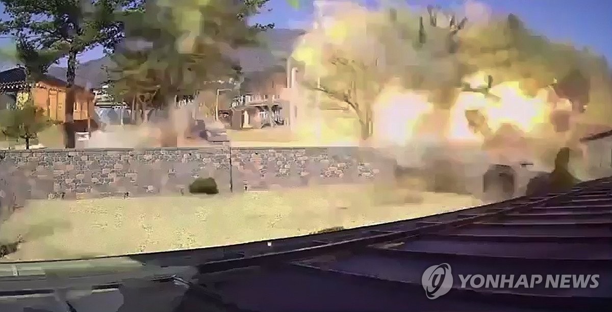 This photo, taken from a closed circuit television camera and provided by the MBN broadcaster on March 7, 2025, shows an accidentally fallen bomb from a fighter jet that exploded in a village in Pocheon, about 40 kilometers north of Seoul, the previous day. (Photo not for sale) (Yonhap)