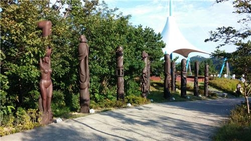 This photo shows various phallus statues lining a path at Haesindang Park in Samcheok on Aug. 23, 2016. (Yonhap)