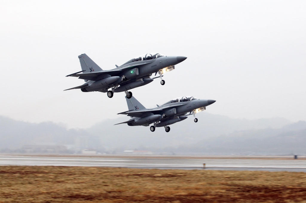 In this photo taken Jan. 8, 2017, and provided by the Korea Aerospace Industries Co. (KAI), two advanced T-50TH trainer jets take off for Thailand. (Yonhap)
