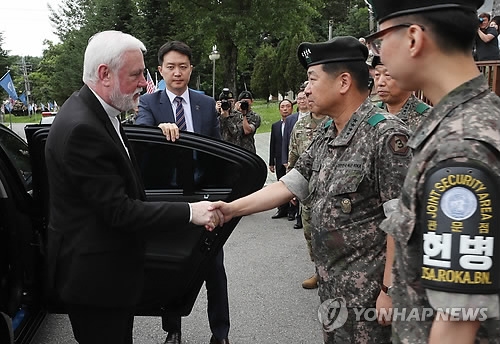 Archbishop Paul Richard Gallagher (L), the Vatican's secretary for relations with states, shakes hands with South Korean military officials during his visit to the Joint Security Area near the tense inter-Korean border on July 5, 2018. (Yonhap)