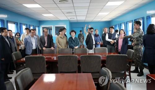 A group of civilian tourists looks around "T2," or the Military Armistice Commission Conference Room, at the Joint Security Area on May 1, 2019. (Yonhap) 