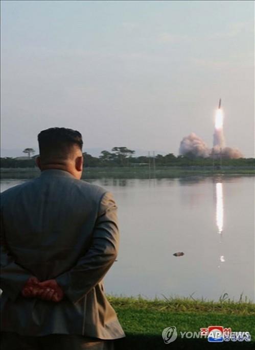 North Korean leader Kim Jong-un watches a missile launch from a site near the North's eastern coastal town of Wonsan on July 25, 2019, in this photo released by the Korean Central News Agency the following day. North Korea fired two short-range missiles into the East Sea, in what it says is a power demonstration of a "new tactical guided weapon." (For Use Only in the Republic of Korea. No Redistribution) (Yonhap)