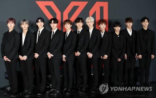 X1 members pose for photos ahead of their debut showcase at Gocheok Sky Dome in western Seoul on Aug. 27, 2019. (Yonhap)