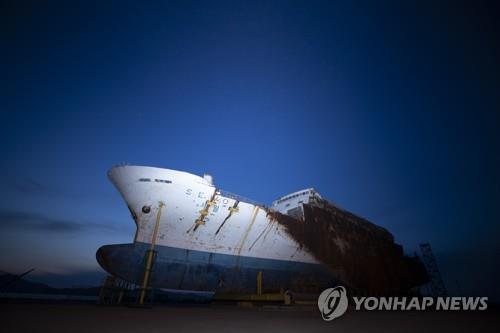 The salvaged Sewol ferry sits at a port in Mokpo, South Jeolla Province, southwestern South Korea, on April 16, 2020, the sixth anniversary of the sinking of the 6,800-ton Sewol passenger ferry. (Yonhap)