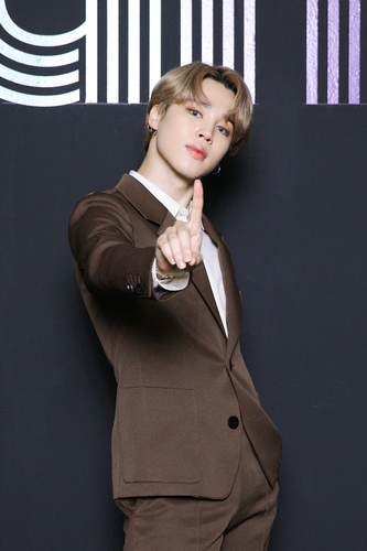 This photo, provided by Big Hit Entertainment on Sept. 2, 2020, shows member Jimin of K-pop sensation BTS posing for photos during an online press conference to celebrate the band's single "Dynamite" debuting at No. 1 on the Billboard Hot 100 chart. (PHOTO NOT FOR SALE) (Yonhap)