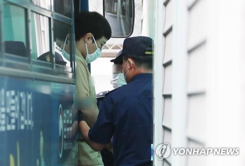 The undated file photo shows Wang Ki-chun heading to attend a court trial. (Yonhap)