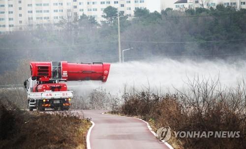 This file photo shows disinfection under way in Icheon, southeast of Seoul, on Nov. 20, 2020, after an outbreak of highly pathogenic avian influenza was reported among wild birds there. (Yonhap)