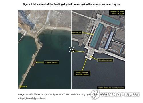 This photo captured from the 38 North website shows satellite imagery showing the movement of the floating drydock to alongside the submarine launch-quay. (PHOTO NOT FOR SALE) (Yonhap) 
