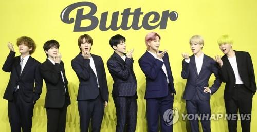 This photo, provided by Big Hit Music, shows BTS posing during a news conference on May 21, 2021. (Yonhap)