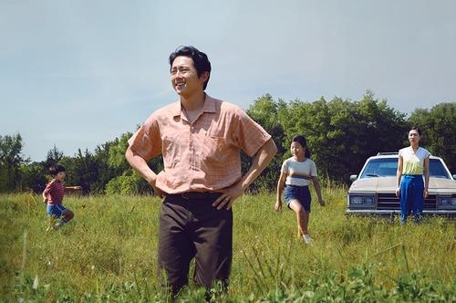 This image provided by Pancinema shows Steven Yeun (C) in a scene from "Minari." (PHOTO NOT FOR SALE) (Yonhap)
