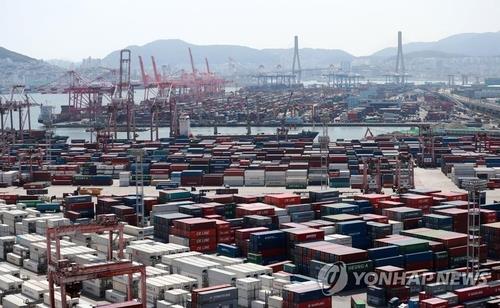 This undated file photo shows cargo containers stacked at a port in Busan, 453 kilometers southeast of Seoul. (Yonhap)