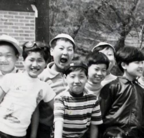 A young Yoon Suk-yeol (3rd from L) is seen in this photo provided by his campaign. (Yonhap) 