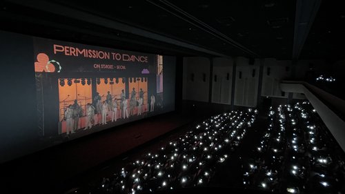 In this photo provided by Hybe, fans watch one of South Korean boy group BTS' three in-person concerts live in Seoul at a Lotte Cinema theater in southern Seoul on March 12, 2022. (PHOTO NOT FOR SALE) (Yonhap)