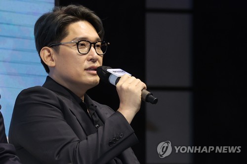 Director Han Jae-rim of "Emergency Declaration," a Korean disaster flick set to open in August, speaks during a press conference to promote the film project at a Seoul hotel on June 20, 2022. (Yonhap)