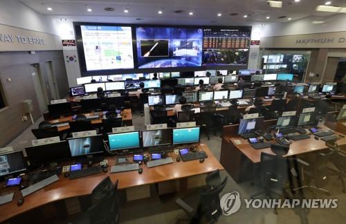 Researchers and officials watch the launch of the Korea Augmentation Satellite System (KASS), the country's first satellite-based augmentation system, at the Korea Aerospace Research Institute in the central city of Daejeon on June 23, 2022. The launch took place at a space center in Kourou, French Guiana. (Yonhap)