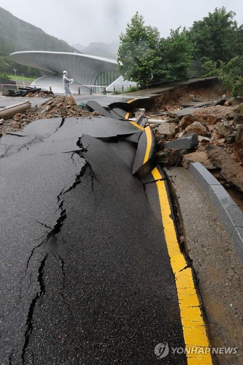 This photo taken Aug. 9, 2022, shows a road damaged inside Seoul National University's Gwanak Campus after torrential rain pounded the capital city and parts of central South Korea overnight. (Yonhap)
