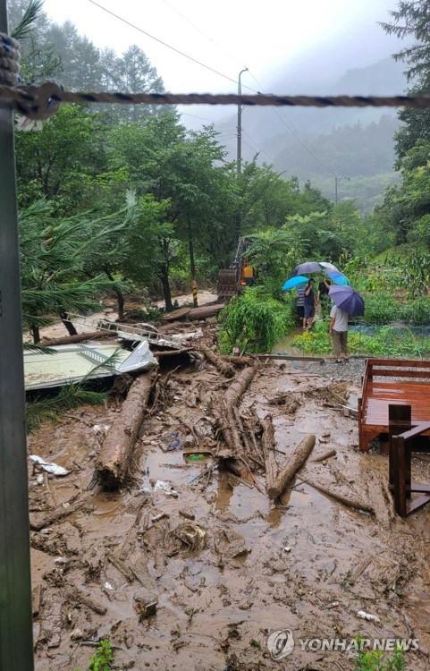 This photo taken Aug. 10, 2022, shows a house that was smashed by a landslide in the eastern county of Hoeseong, Gangwon Province, amid torrential rain. The Hoeseong fire station provided this photo. (PHOTO NOT FOR SALE) (Yonhap) 
