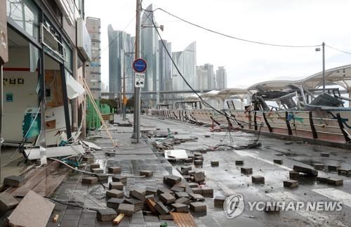 A seaside park in Busan is in tatters on Sept. 6, 2022, after Typhoon Hinnamnor hit the city. (Yonhap)